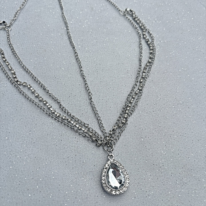Hair jewellery accessory, silver tone layered chains, teardrop crystal pendant with diamante border, elegant decorative headpiece, festival inspired style, sparkling statement hair accessory, chic gift for her
