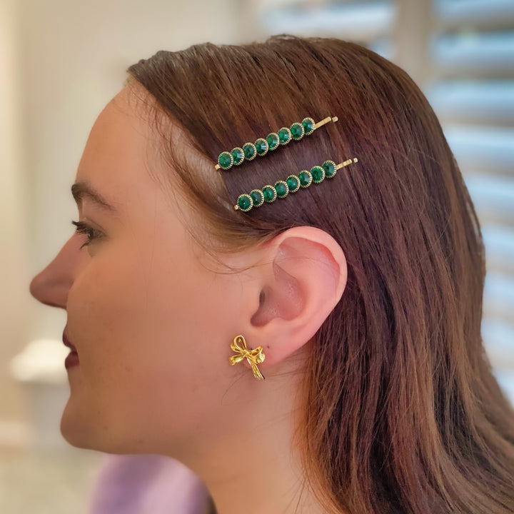 Green hair slides, gold tone grips, round green crystal embellishments, slim bar design, sparkling decorative hairpins, vintage inspired style, elegant hair accessory set, gift for her