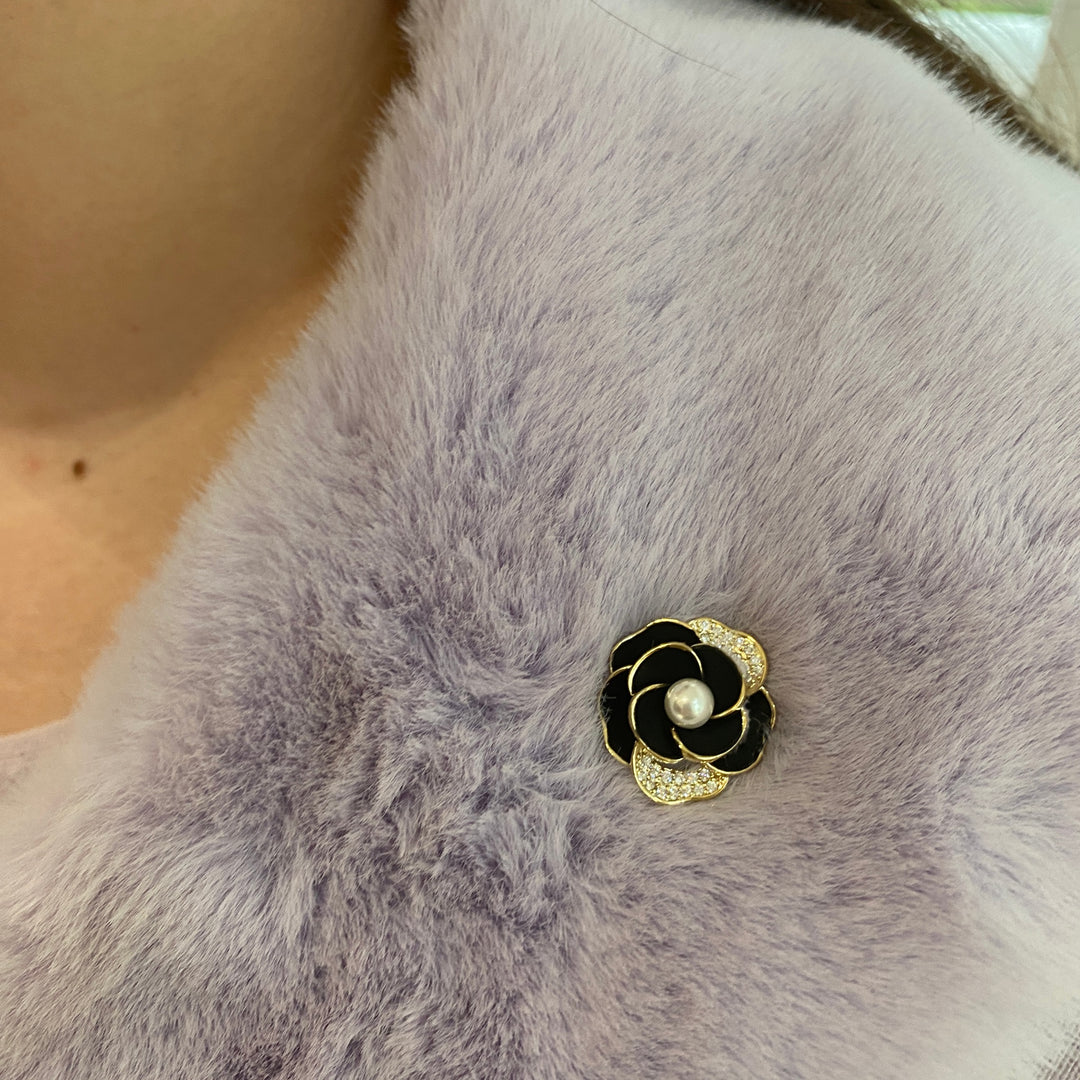 Rose brooch, black enamel petals, gold tone detailing, central pearl accent, diamanté trim, vintage inspired style, elegant decorative accessory