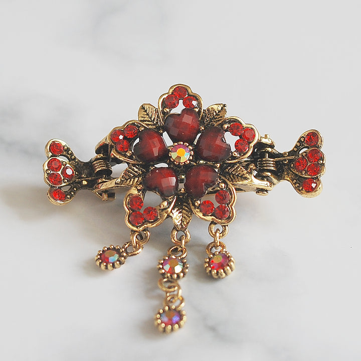flower hair accessory in red with gems