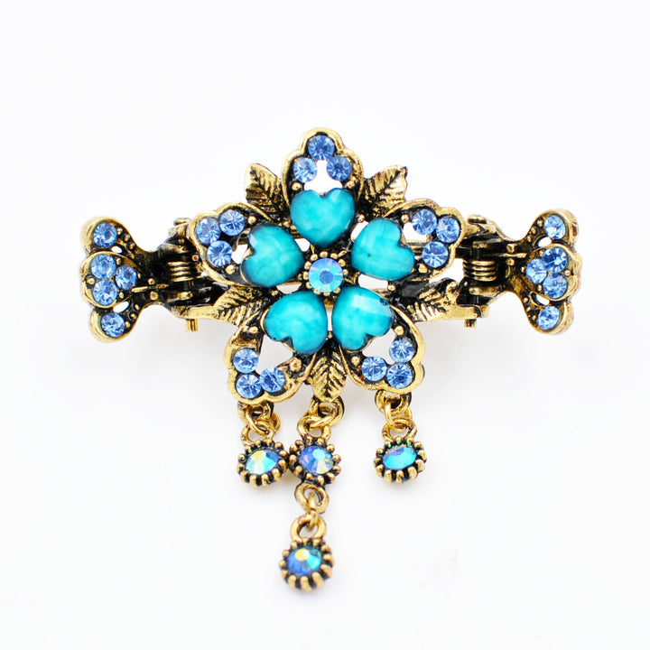 flower hair accessory with turquoise gems
