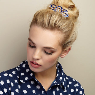 flower hair clip in blue enamel with hair bun