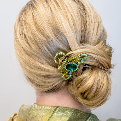 green hair claw clip with jewels bun hairdo
