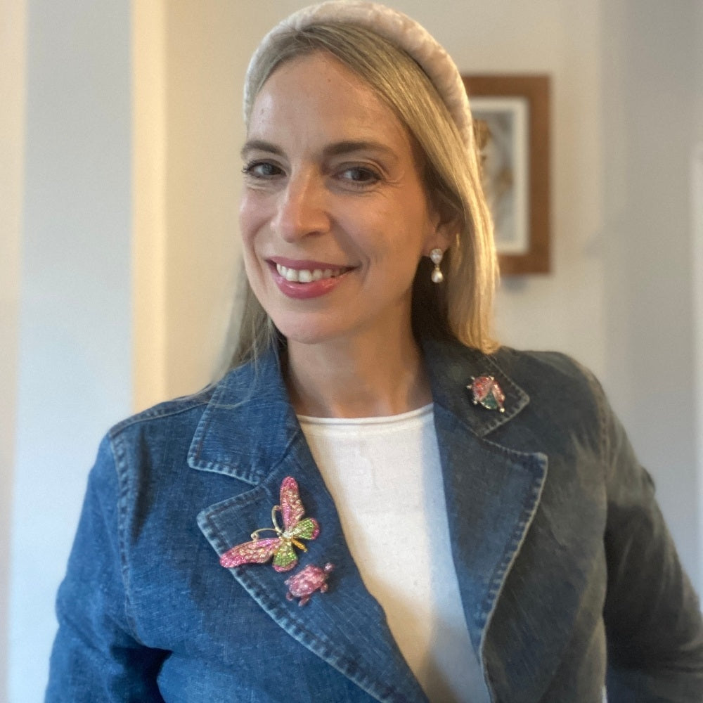 Set of three brooches featuring a crystal butterfly with pink and green stones, a gold-tone turtle with green crystal detailing, and a red crystal ladybird with gold accents.