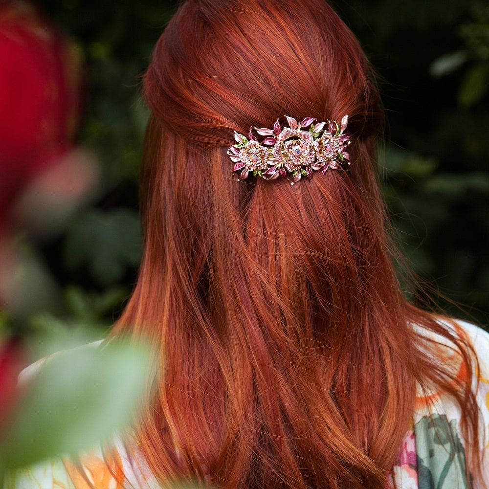 half up half down hair for a wedding guest floral hair clip with floral dress