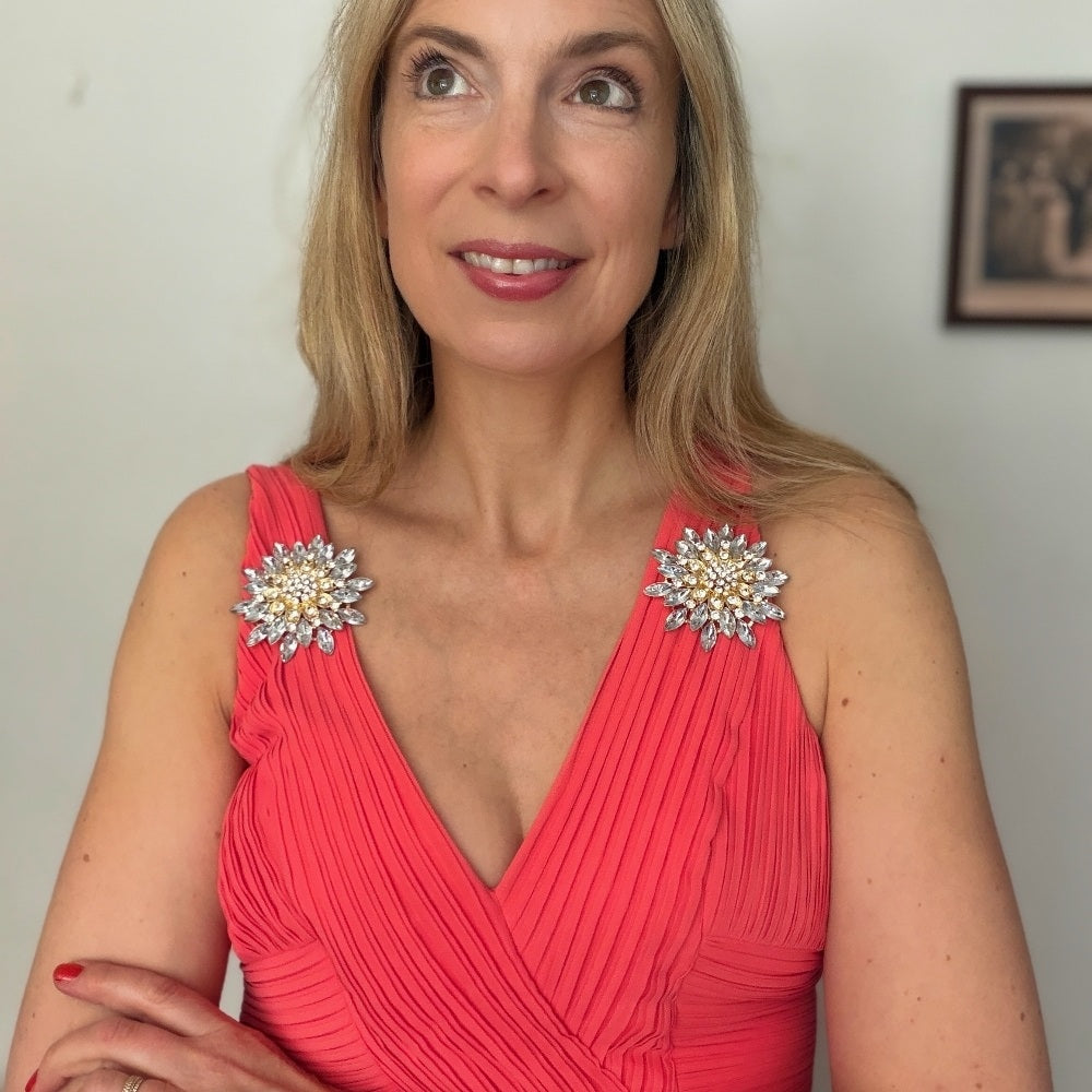 wedding brooch styling large brooches placed on shoulders of wedding guest outfit
