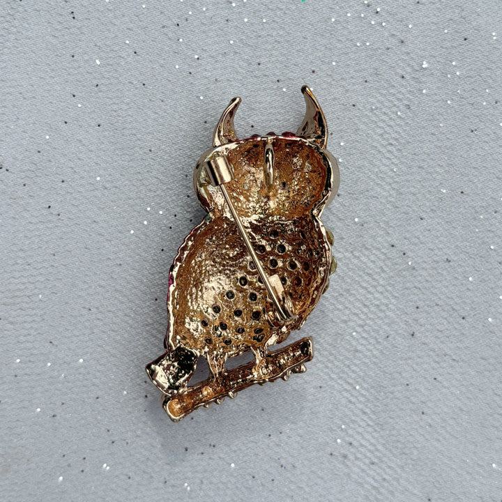 Gold owl brooch, textured metal design, perched on branch detail, secure pin fastening, vintage inspired animal jewellery, statement accessory, elegant gift for her
