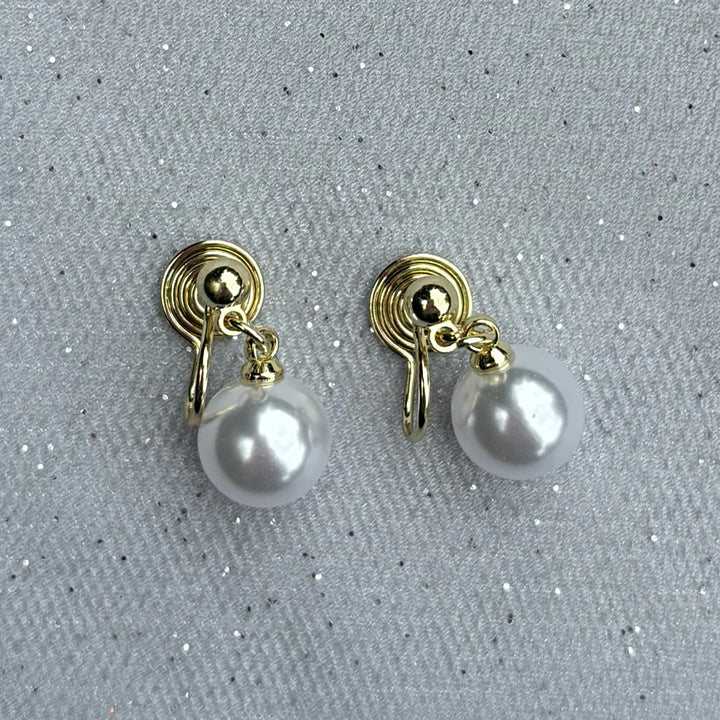 Pearl drop clip-on earrings, gold tone setting, round white faux pearls, classic timeless design, elegant statement jewellery, vintage inspired style, comfortable non-pierced earrings, sophisticated accessory or gift for her
