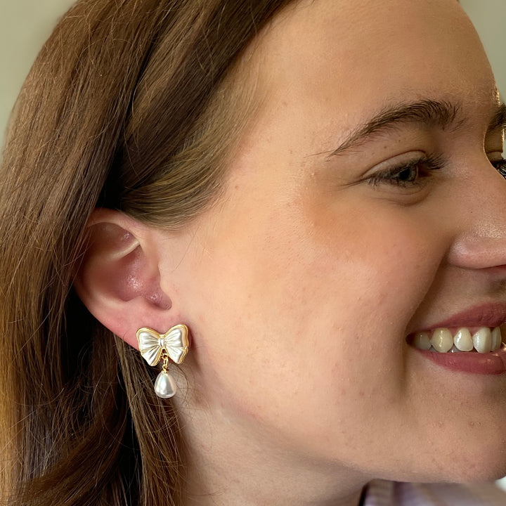 pearl drop earrings, bow earrings, gold and pearl studs, elegant bridal jewellery, dainty feminine accessories, classic pearl earrings for special occasions
