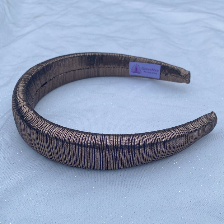 Bronze metallic padded headband with ribbed shimmer fabric.