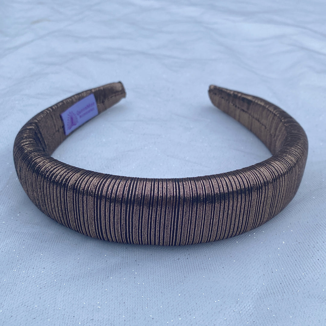 Bronze metallic padded headband with ribbed shimmer fabric.