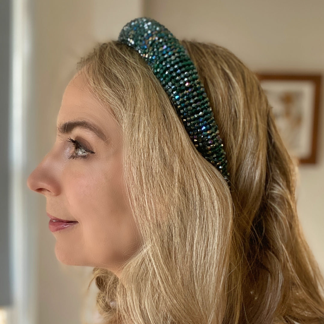 Emerald green beaded headband covered in sparkling crystals on a padded band.