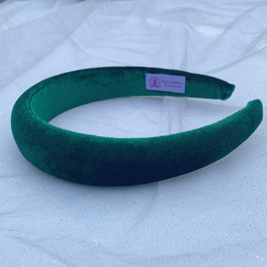 Green velvet hairband with a soft padded design.