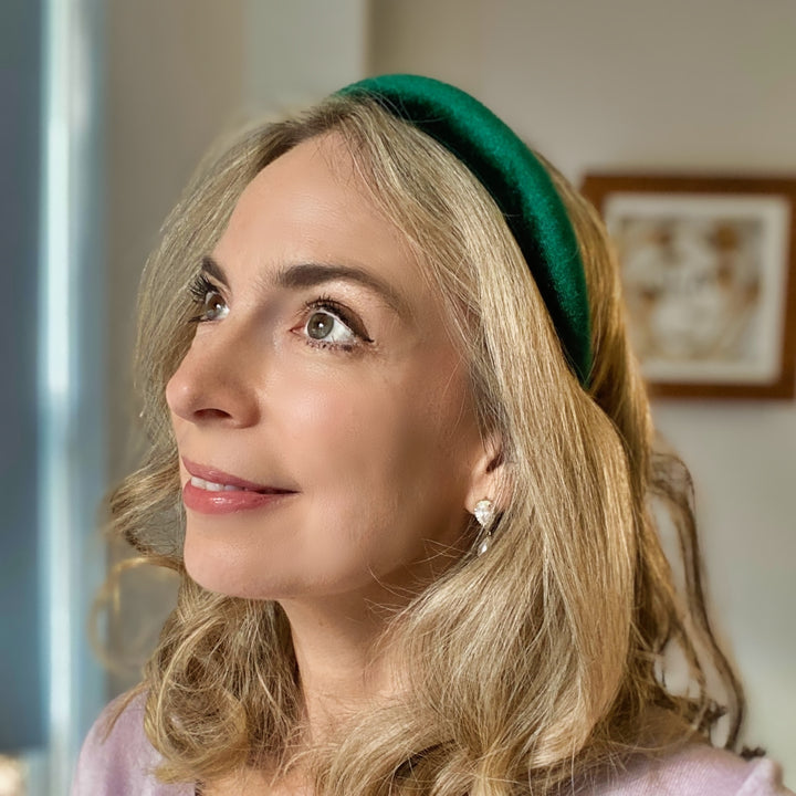 Green velvet hairband with a soft padded design.
