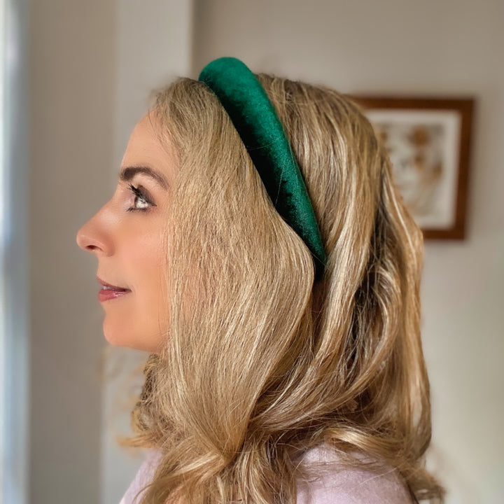 Green velvet hairband with a soft padded design.