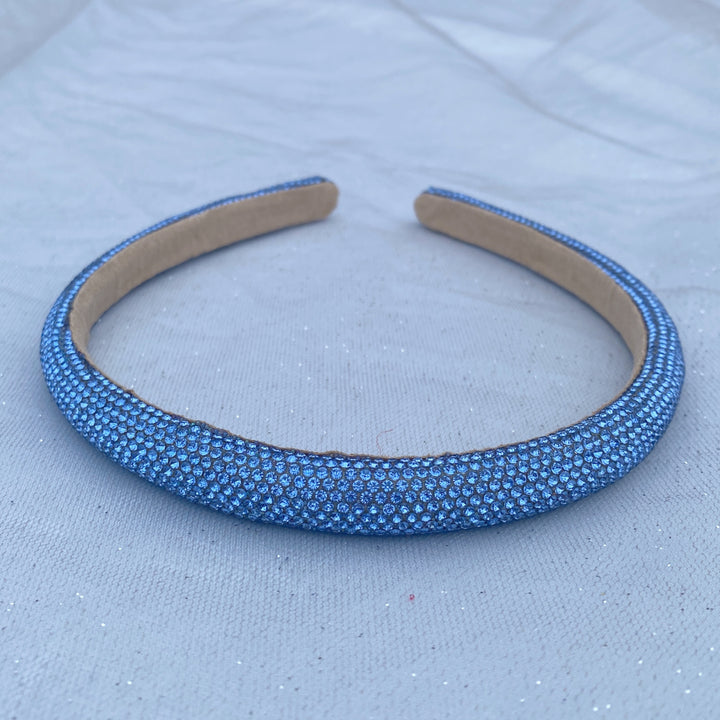 Light blue sparkly headband covered in uniform glittering crystals.