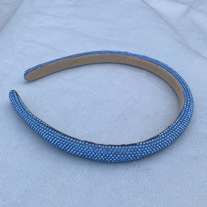 Light blue sparkly headband covered in uniform glittering crystals.