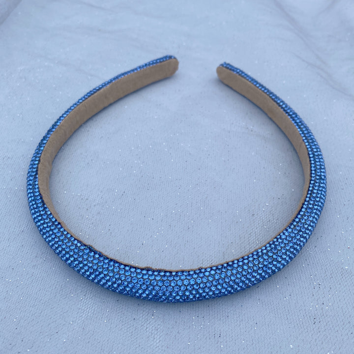 Light blue sparkly headband covered in uniform glittering crystals.
