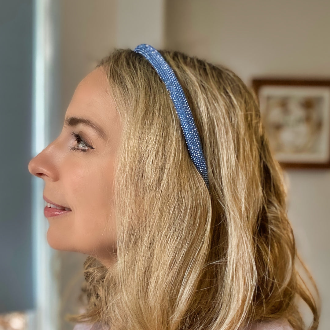 Light blue sparkly headband covered in uniform glittering crystals.