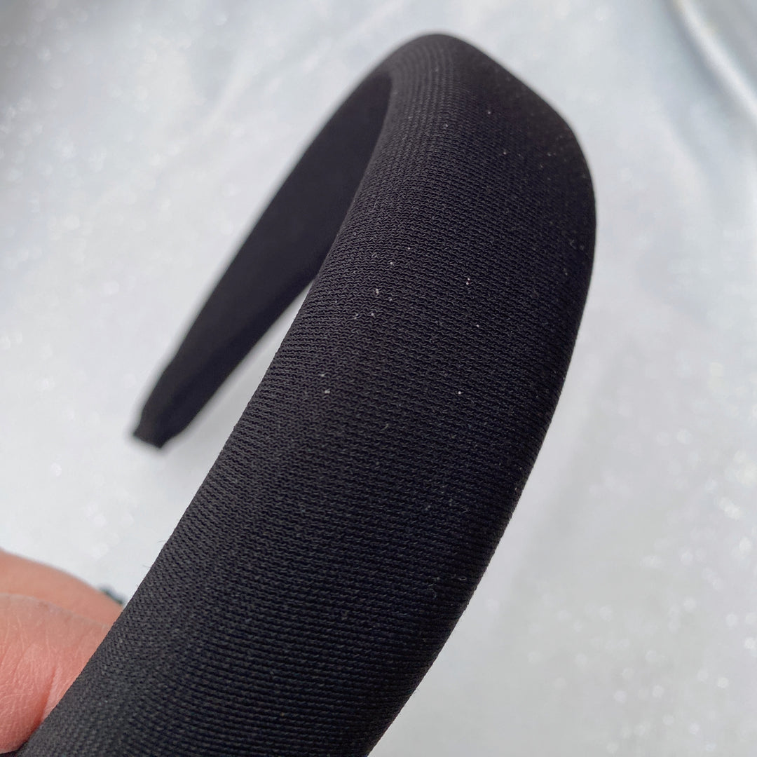Black sparkly padded headband with subtle shimmer detailing