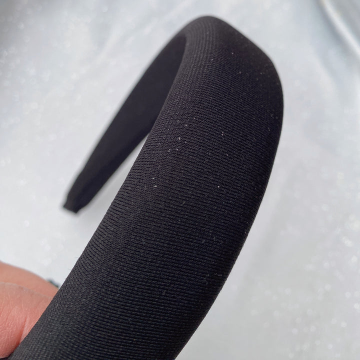 Black sparkly padded headband with subtle shimmer detailing
