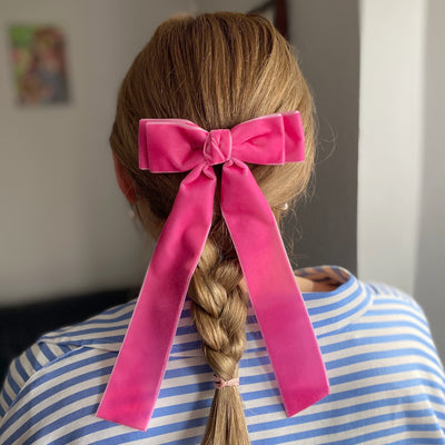 pink velvet hair bow braid hairstyle