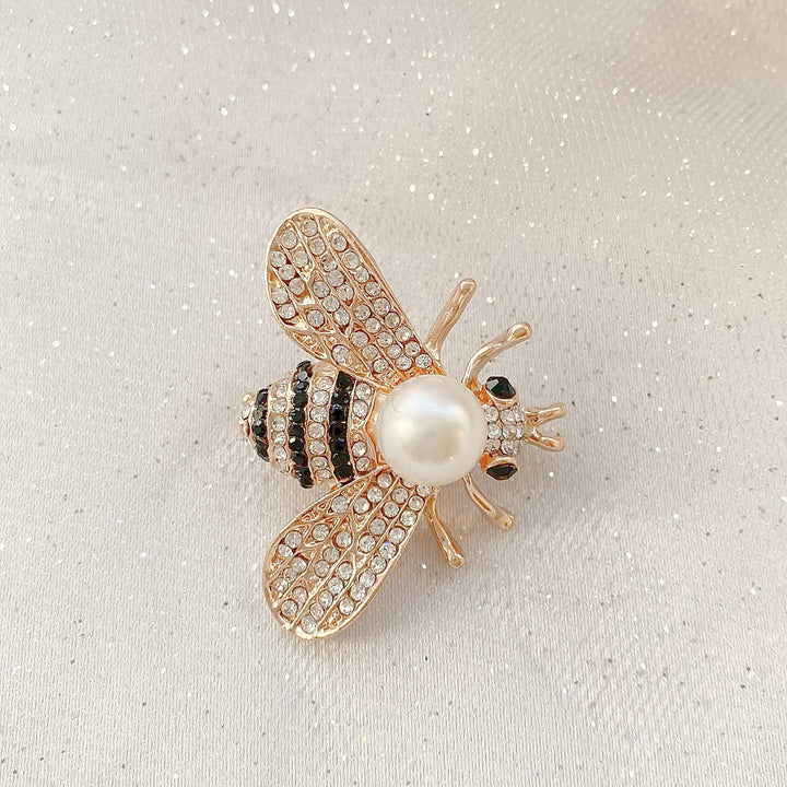 bee brooch in gold with pearl charity pin with crystal