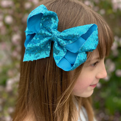 big hair bow in blue for flower girl