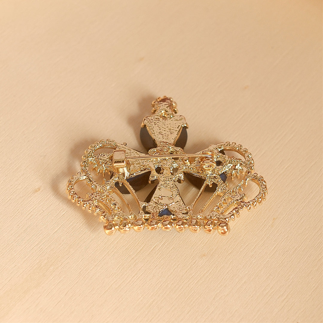 blue brooch with rhinestone back