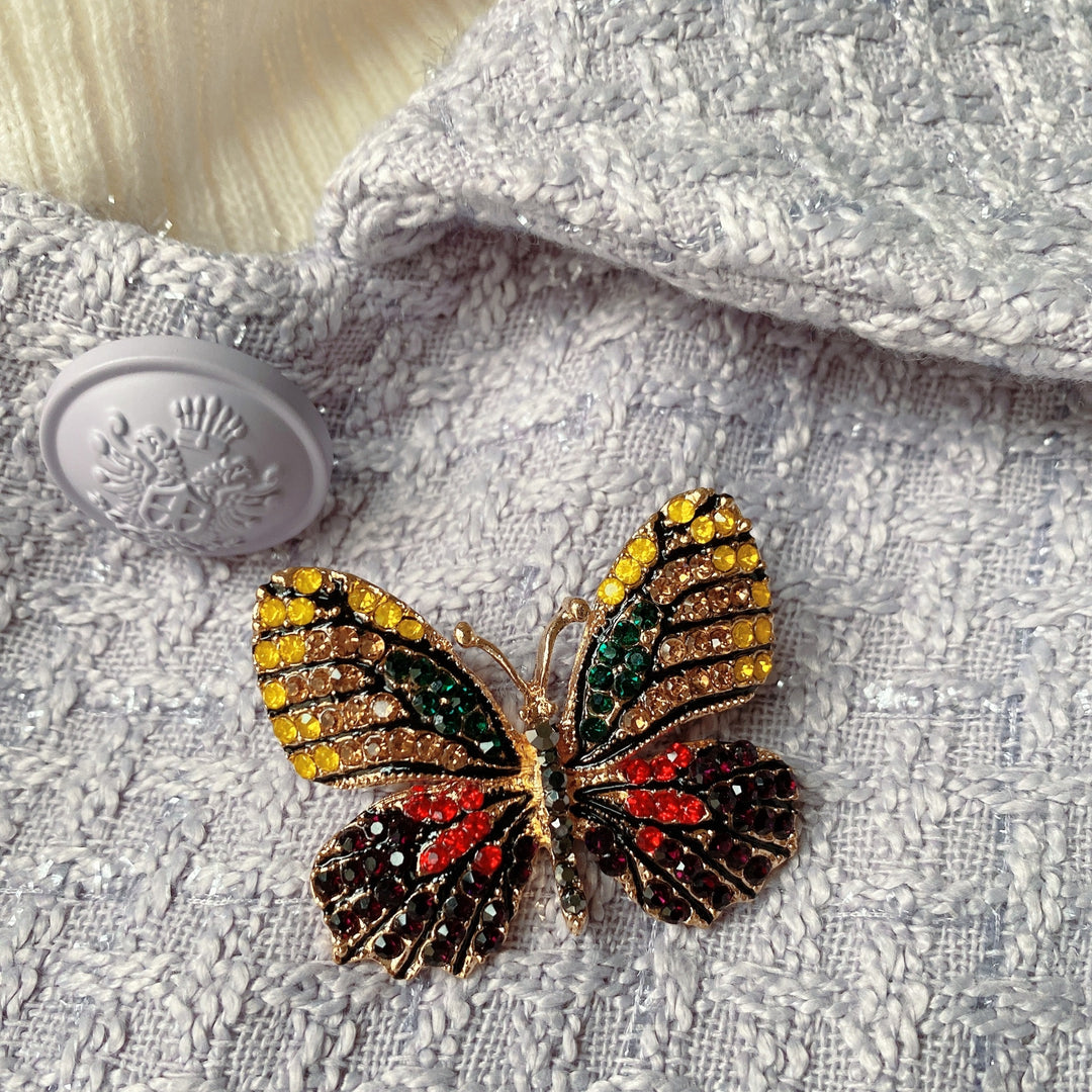 butterfly brooch with crystal in gold