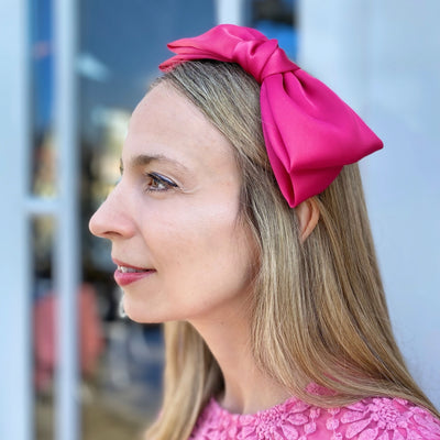 fascinator bow headband in hot pink for wedding guest