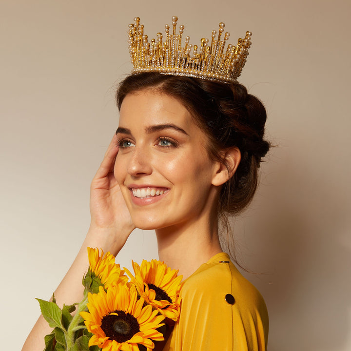 gold crown with pearls with braided updo