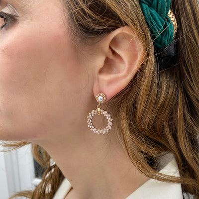 gold pearl earrings circular on wedding guest