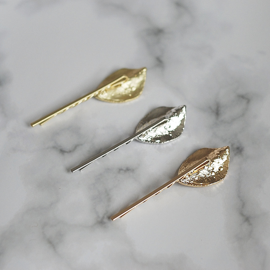 leaf hair clips back in silver and gold