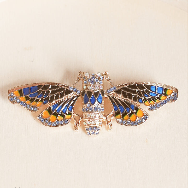 moth brooch in blue enamel with crystal