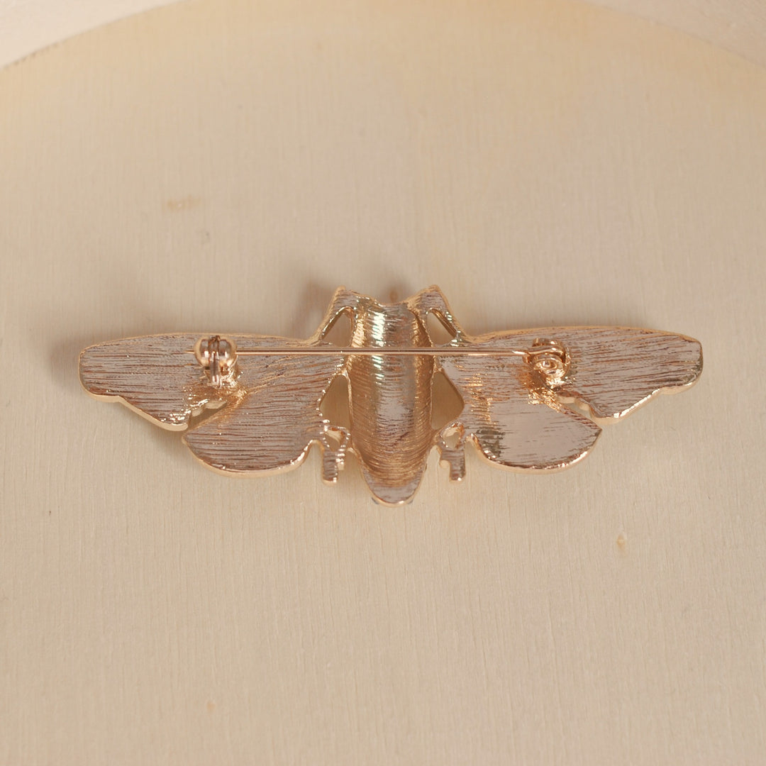 moth brooch gold back