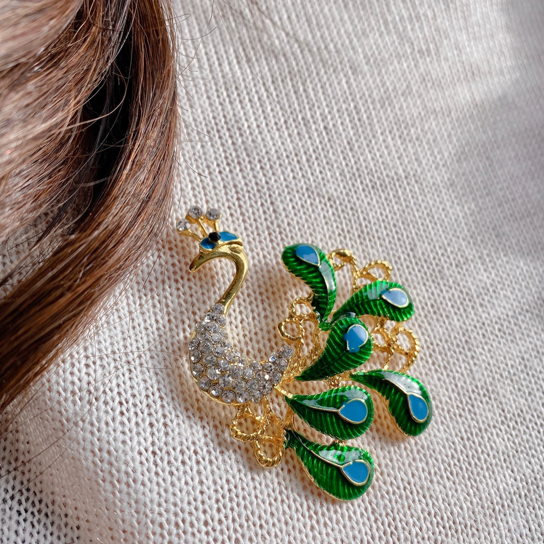 peacock brooch in enamel and crystal blue gold