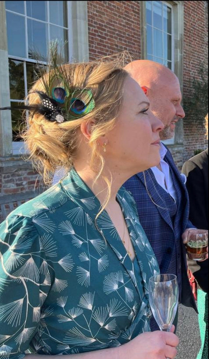 peacock feather fascinator wedding guest hair up