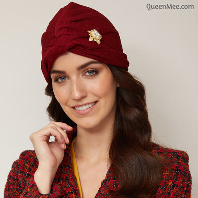 red turban hat with brooch