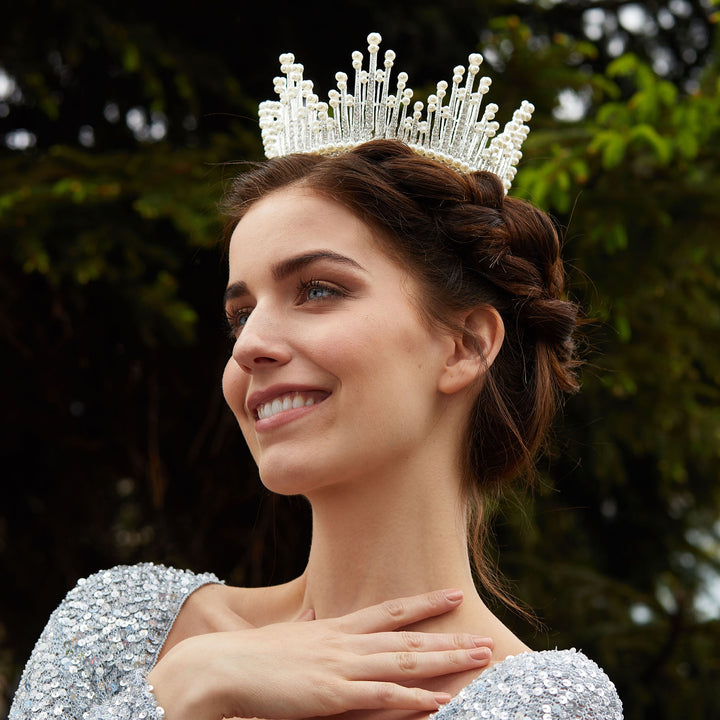 silver crown with pearls worn with braid updo