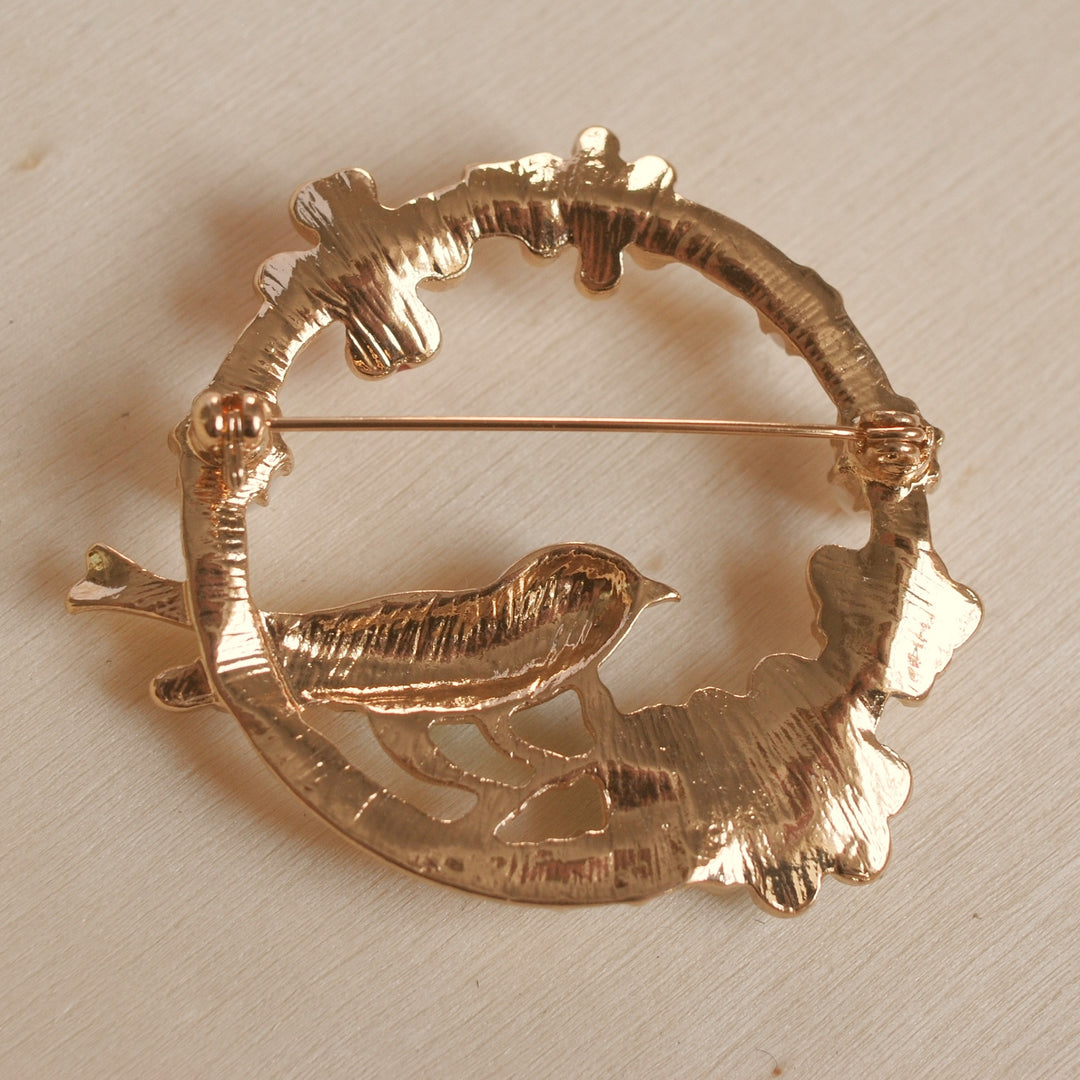 vintage brooch with bird in enamel gold back